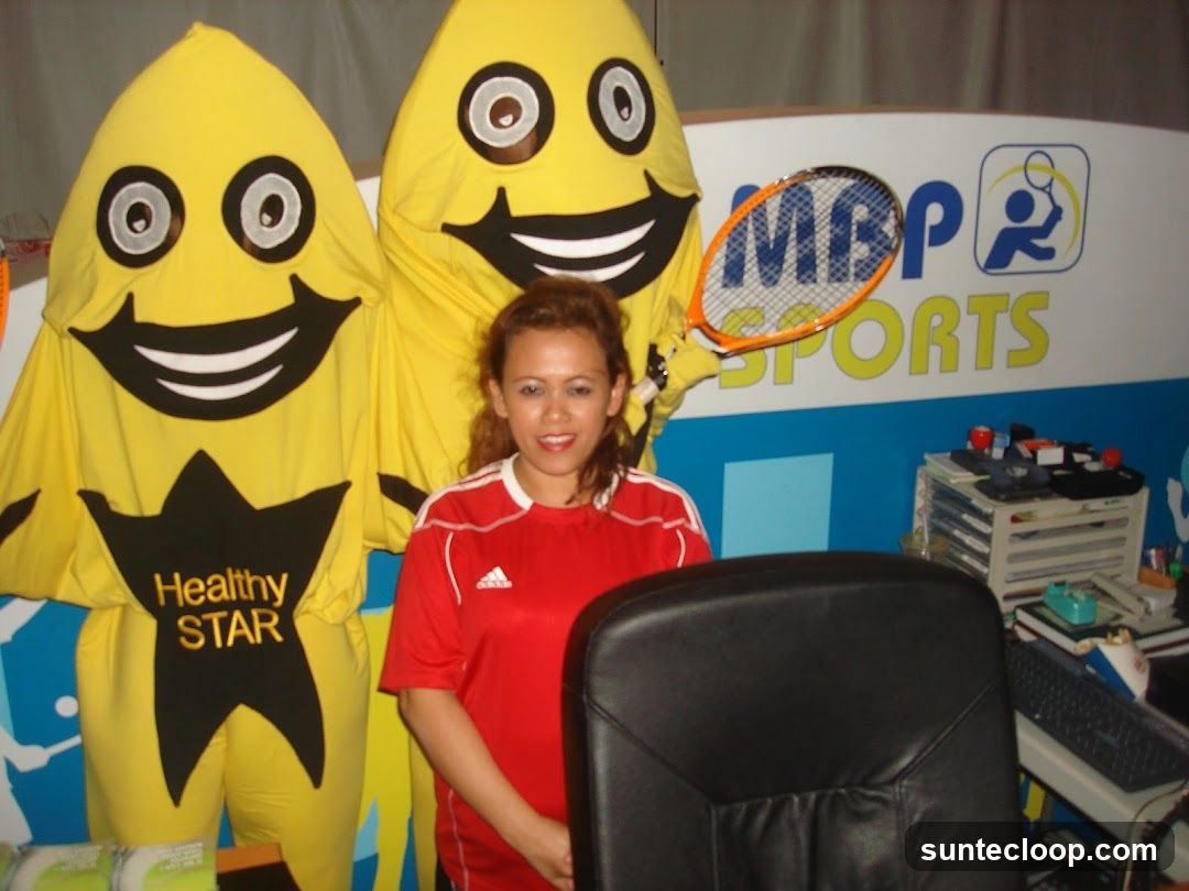 Mascots and Woman with Tennis Racket