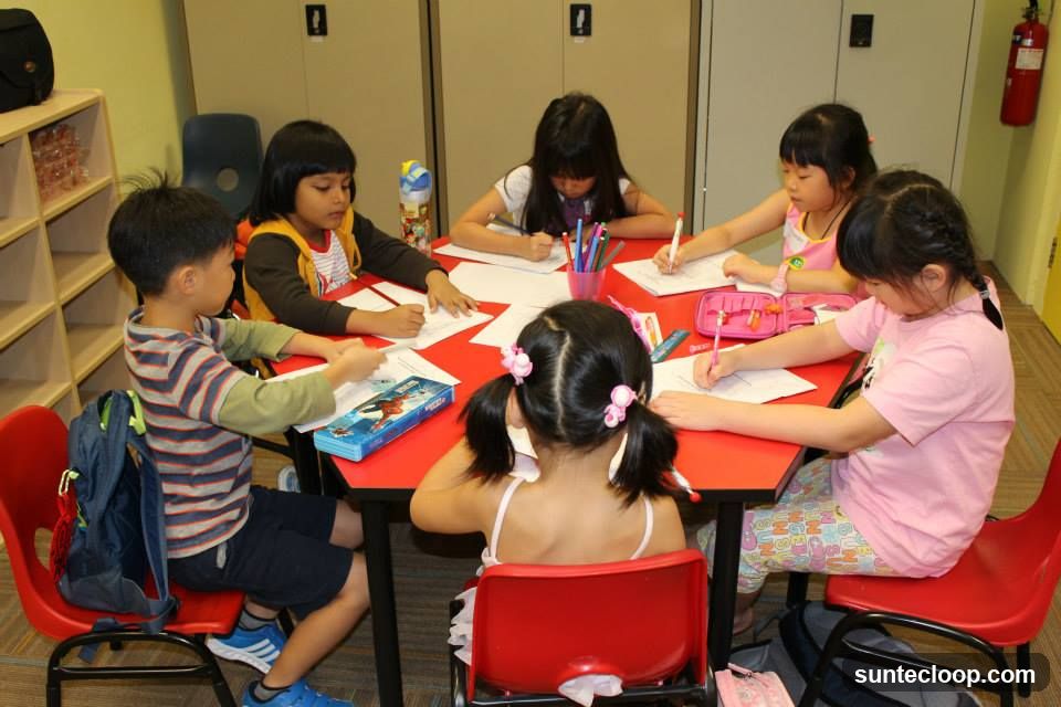 Children Drawing at a Table