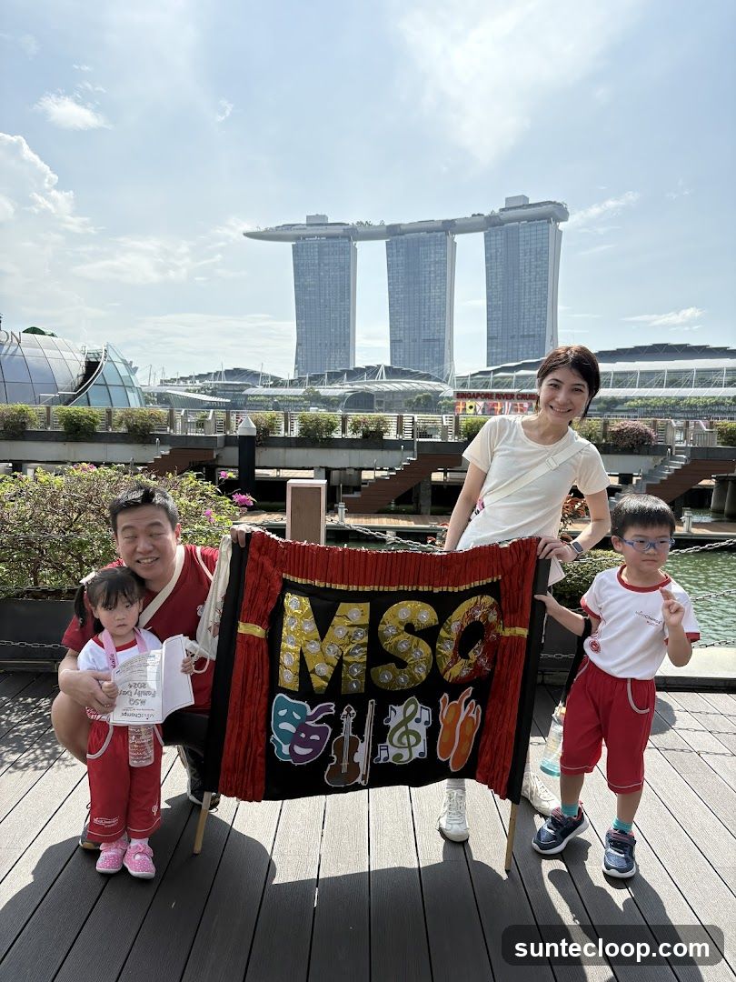 Family holding a banner