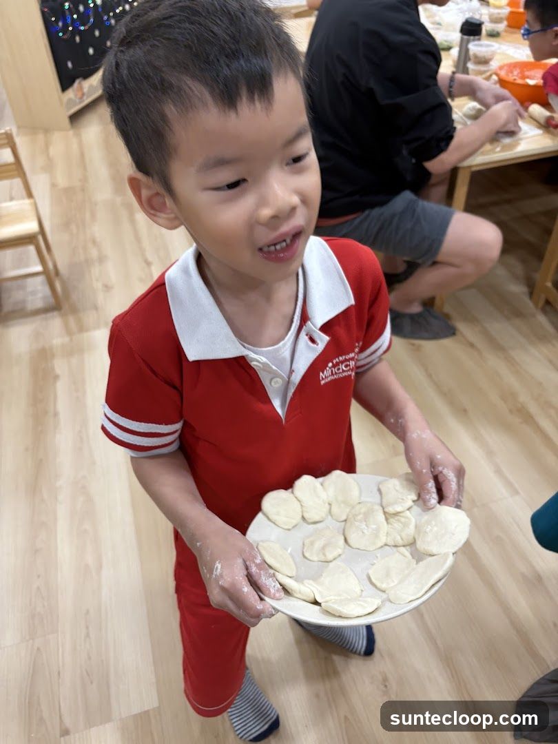 Child holding dough pieces