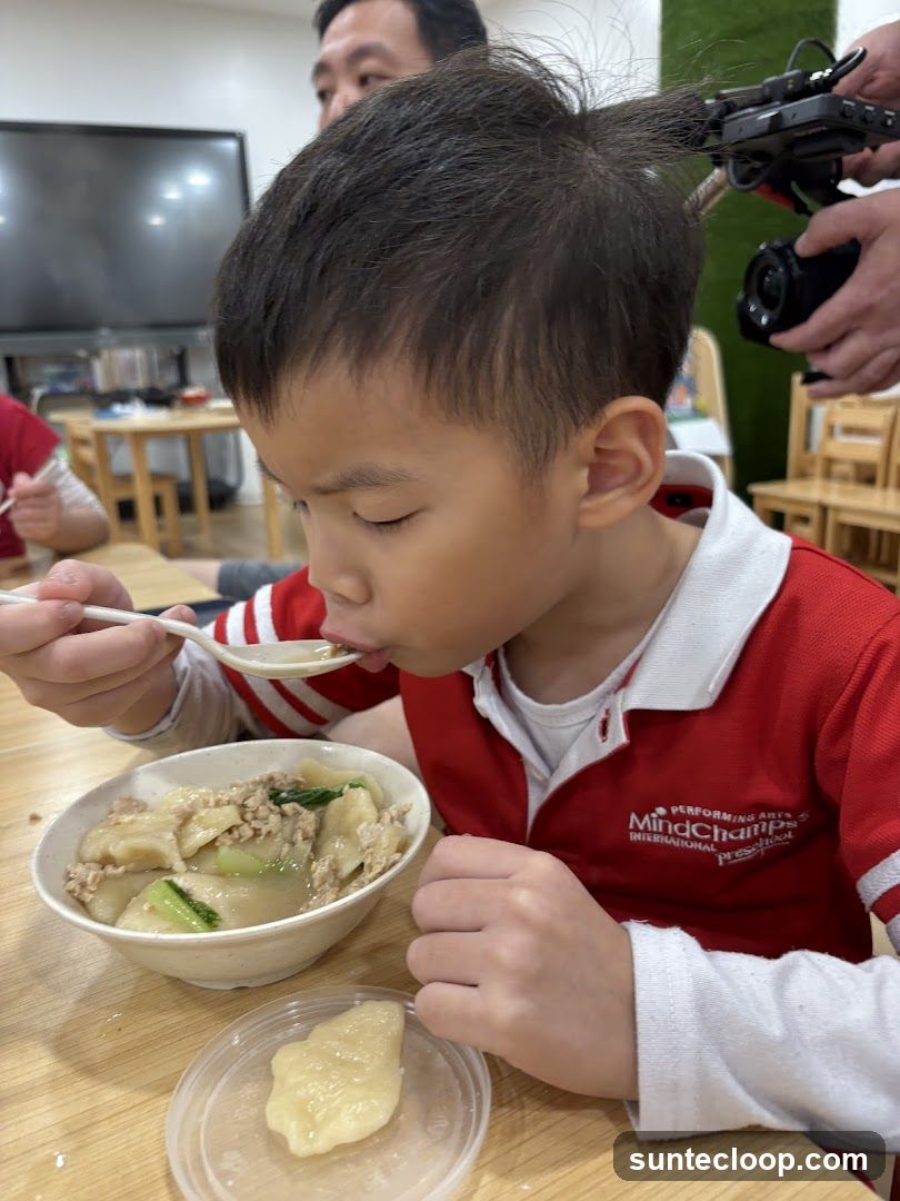Child Eating Dumplings