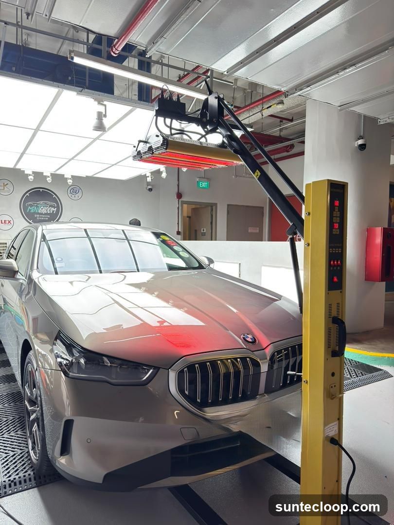Car undergoing treatment with infrared lamps