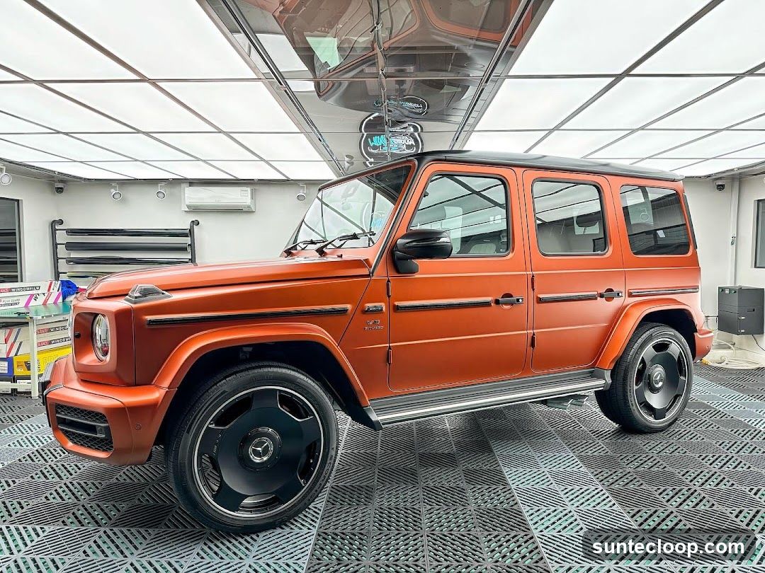 Orange Mercedes G-Wagon in a Detailing Bay