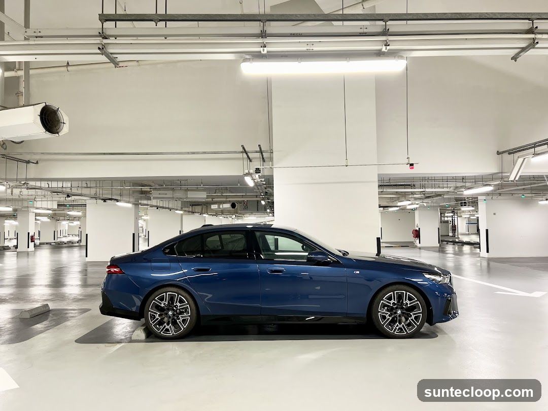 Blue Sedan in Parking Garage