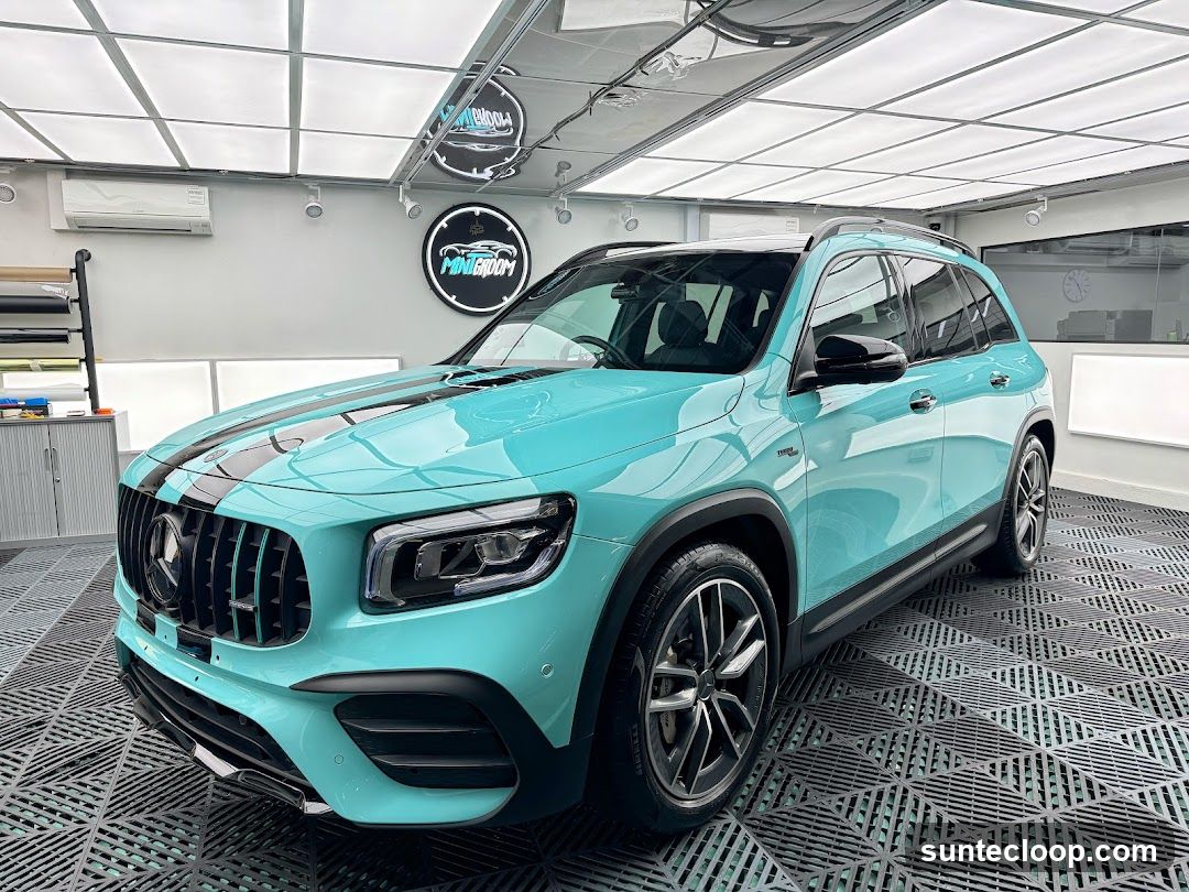 Turquoise Mercedes-Benz SUV with Black Stripes