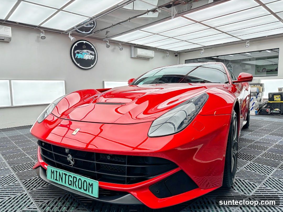 Red Ferrari in a Car Detailing Studio