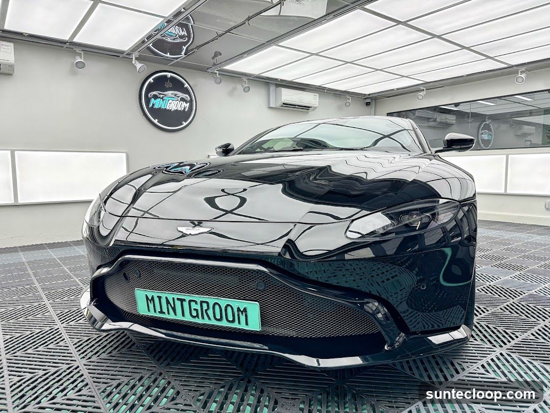 Black Aston Martin in a Car Grooming Bay