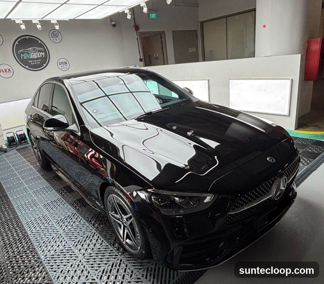 Black Mercedes-Benz car in a detailing studio