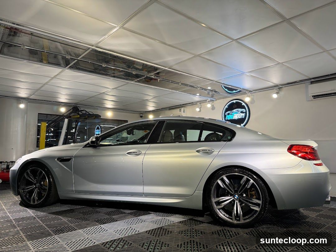 Silver BMW M6 in a Car Wash