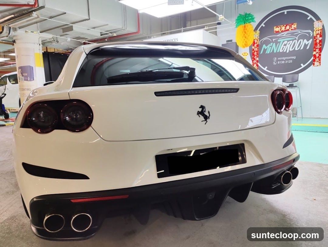 White Ferrari with Car Detailing Signage