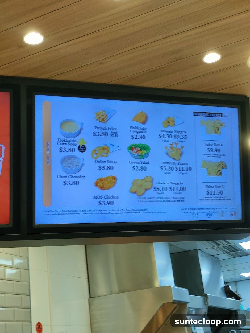 A digital menu board displays various food items and their prices.