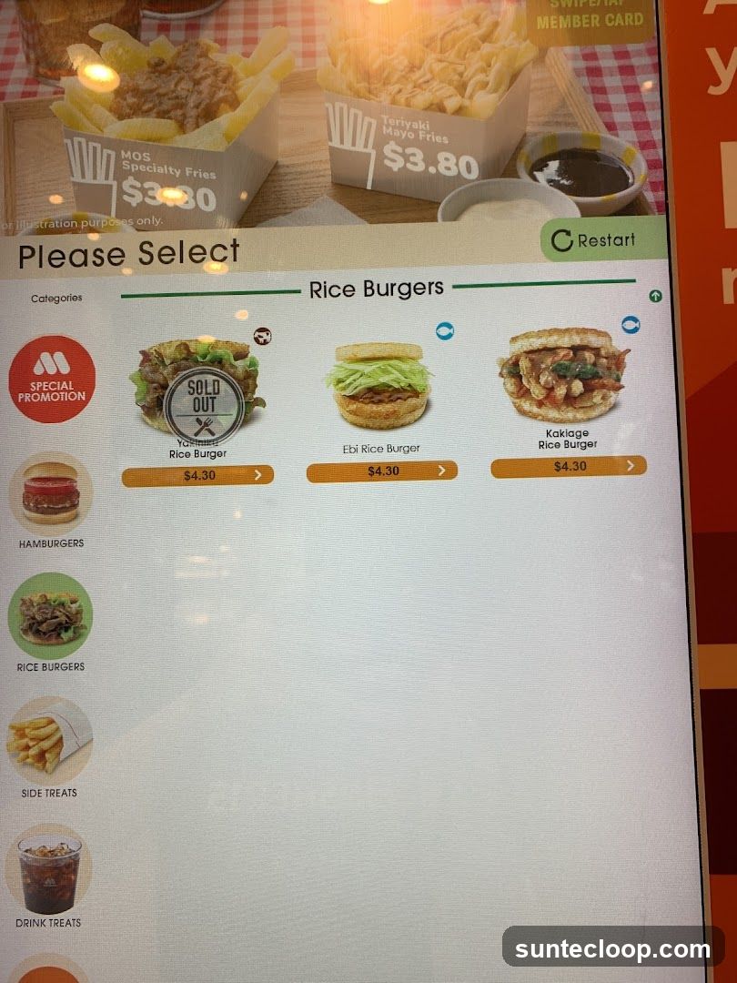 A digital menu displaying rice burgers and other categories. The top section shows MOS Specialty Fries and Teriyaki Mayo Fries, both priced at $3.80. The main section displays three rice burger options: a sold-out Yakitori Rice Burger, an Ebi Rice Burger, and a Kakiage Rice Burger, all priced at $4.30. Categories on the left include Special Promotion, Hamburgers, Rice Burgers, Side Treats, and Drink Treats.