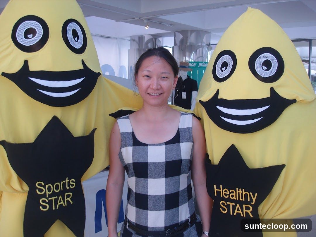 Woman Poses Between Two Mascots