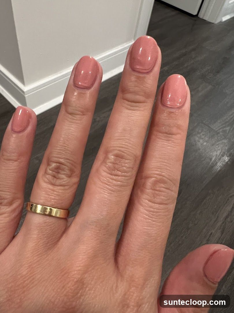 Woman's Hand with Pink Nail Polish