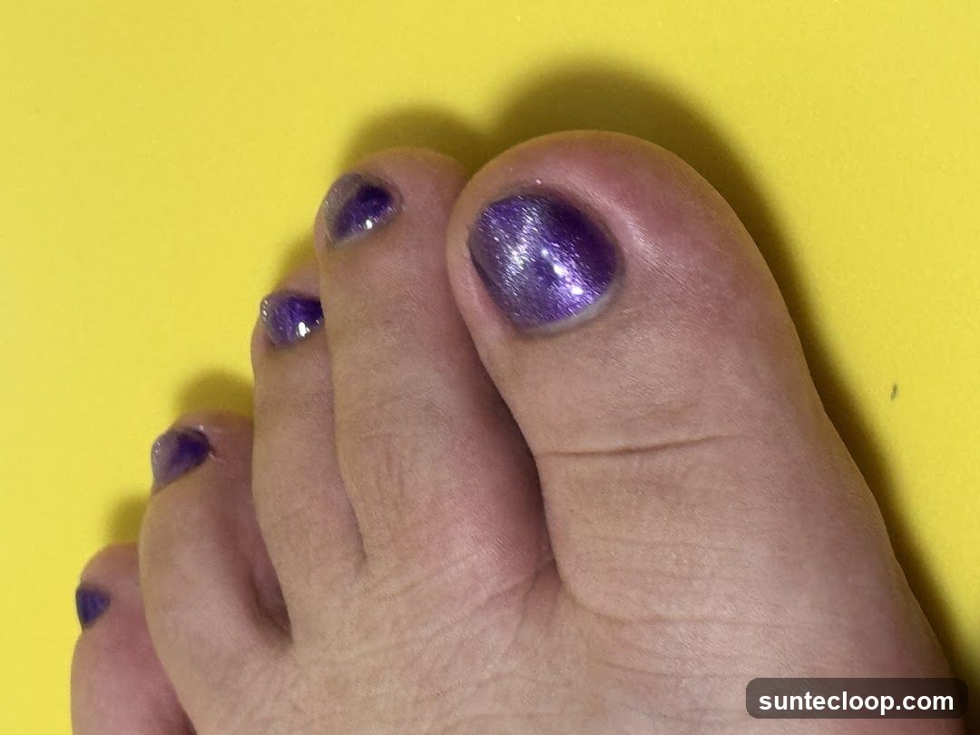 Toes with Purple Glitter Nail Polish
