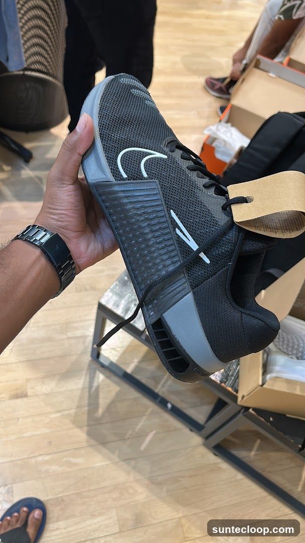 Man holding a Nike shoe