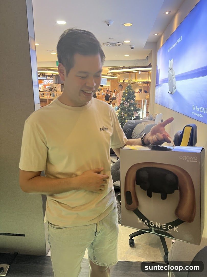 Man Holding a Massage Device Box