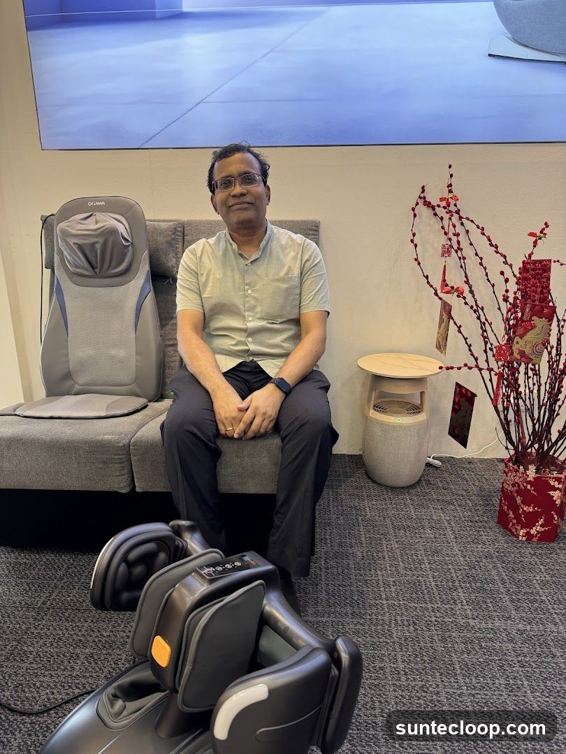Man sitting near massage chairs