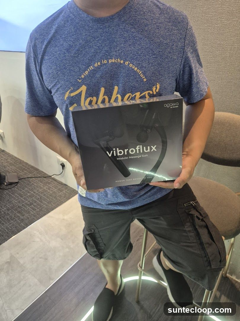Person holding a massage gun box