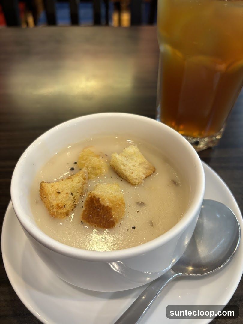 Creamy Soup with Croutons and Iced Tea