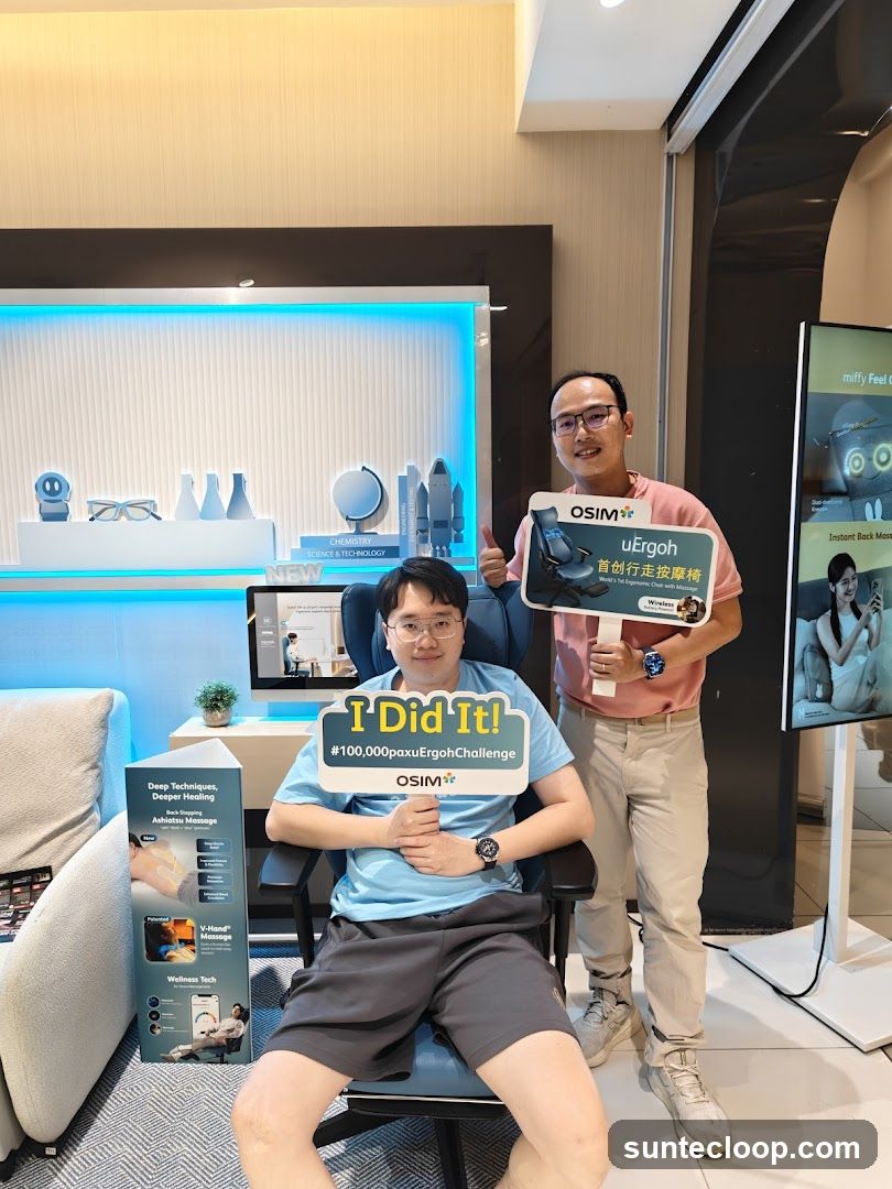 Two men posing with massage chair