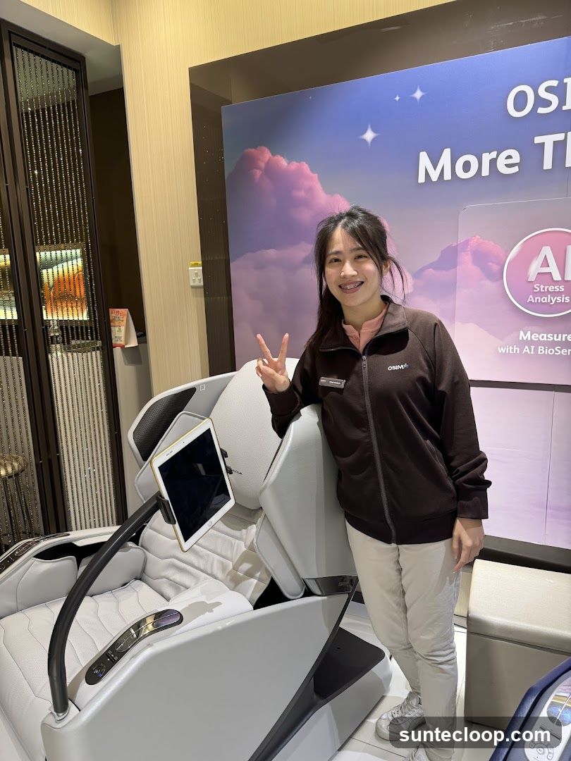 Woman posing next to a massage chair
