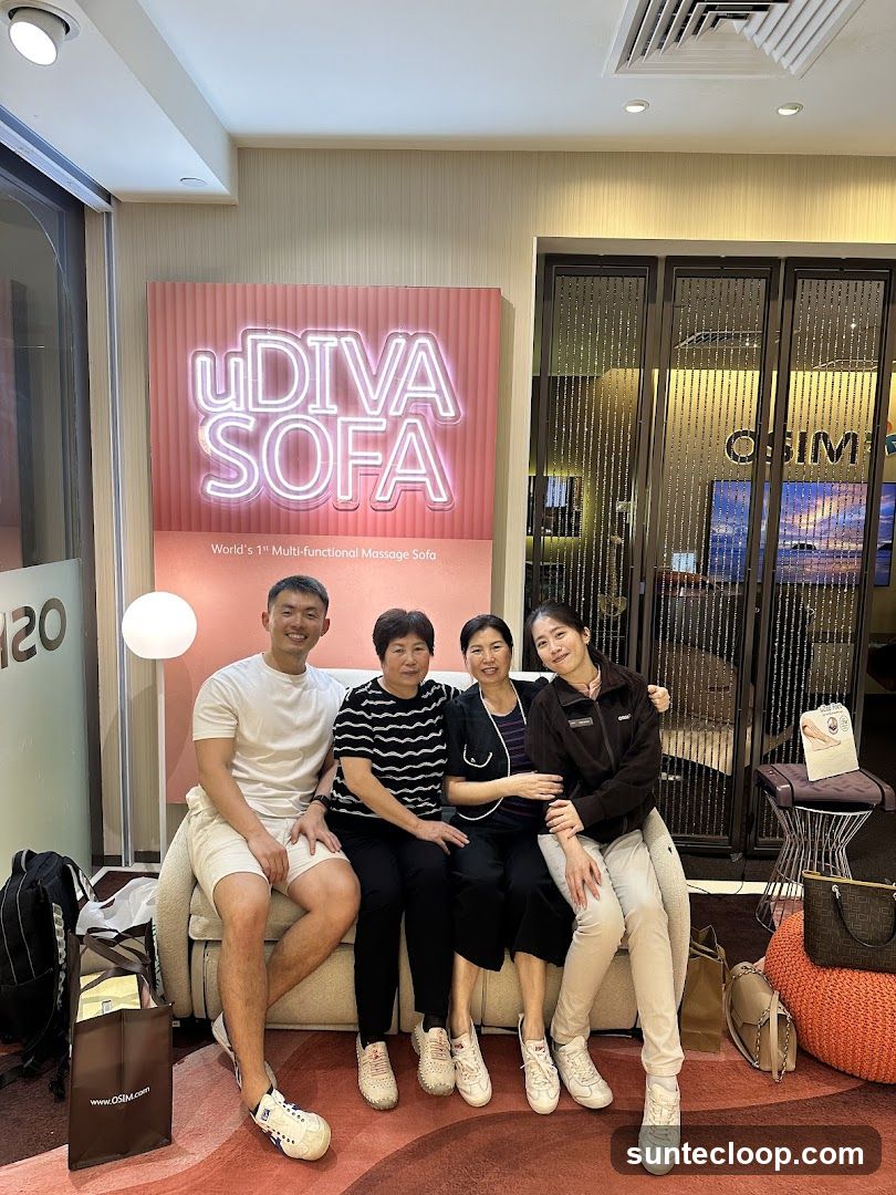 Family Posing in front of a Massage Sofa Display