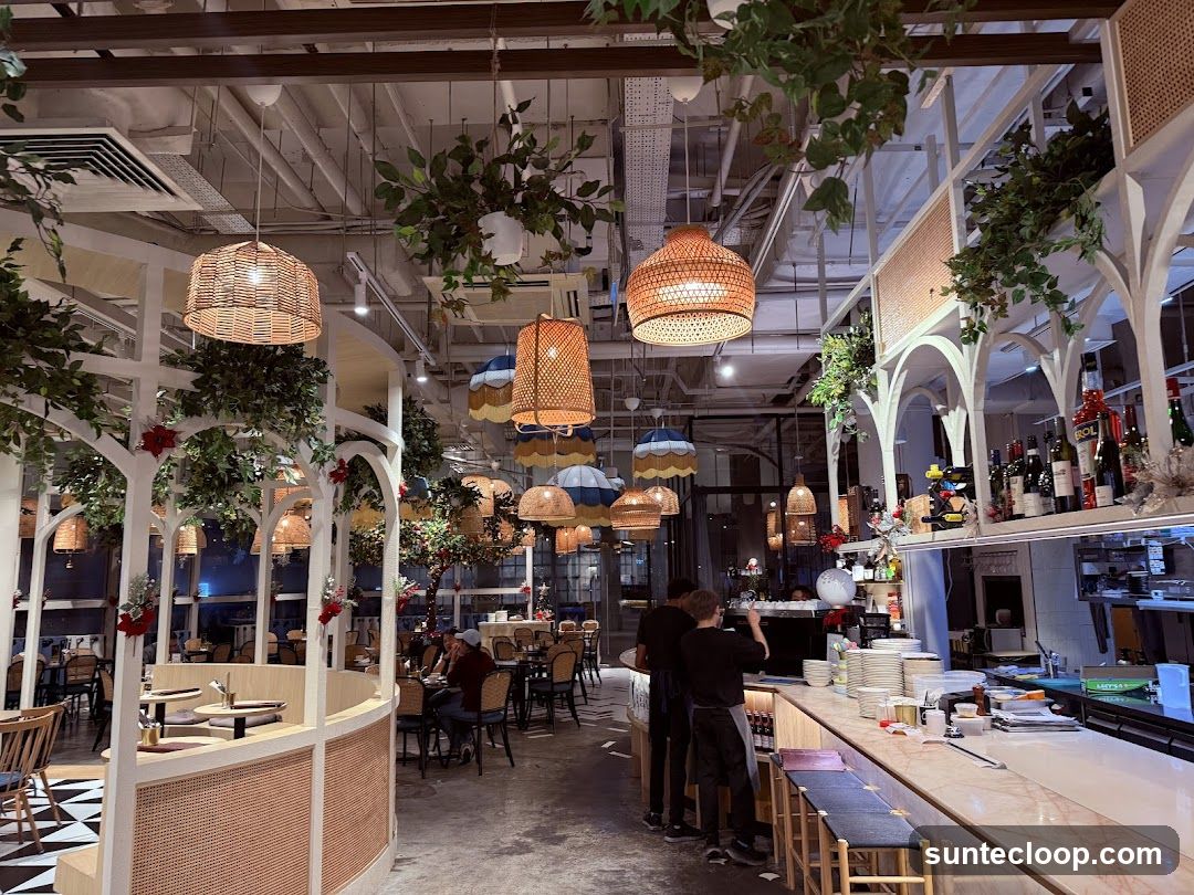 Restaurant Interior with Wicker Lamps and Greenery