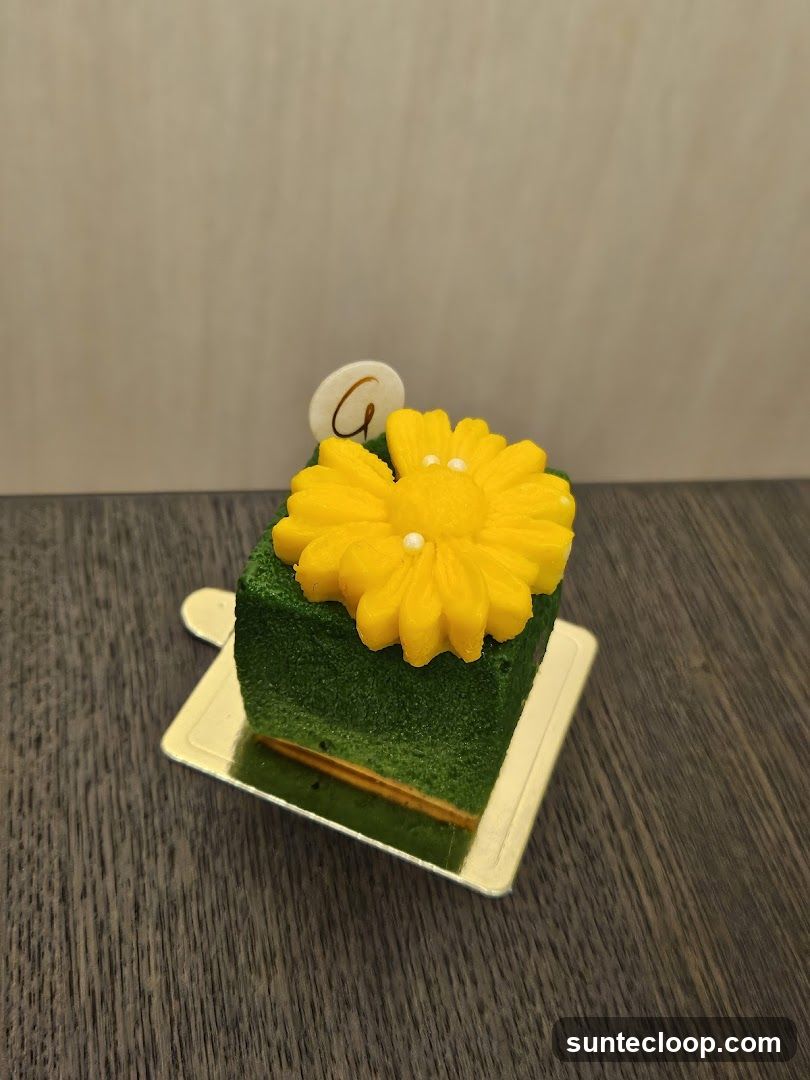 Green Cake with Yellow Flower Decoration
