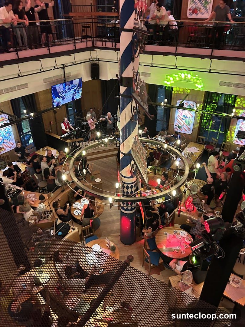 Interior of a lively multi-level establishment with a band playing