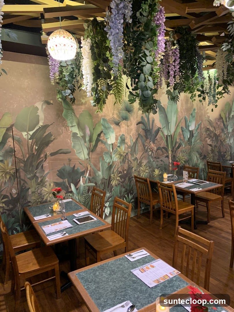 Restaurant Interior with Tropical Mural and Hanging Flowers