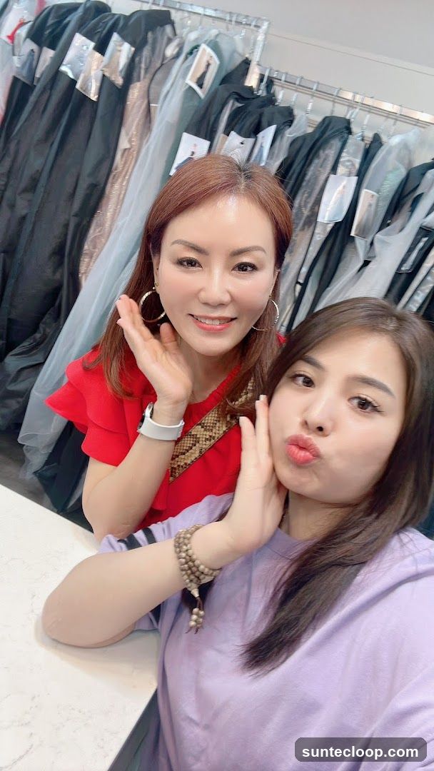 Two Women Posing in a Clothing Store