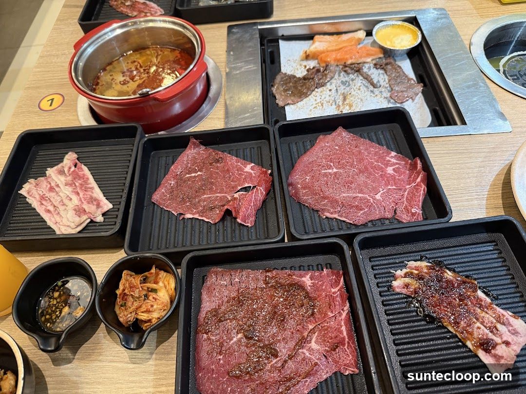 Assortment of Raw and Cooked Meats with Dipping Sauces and Kimchi