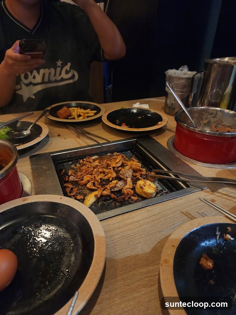 Table with grilled food and side dishes