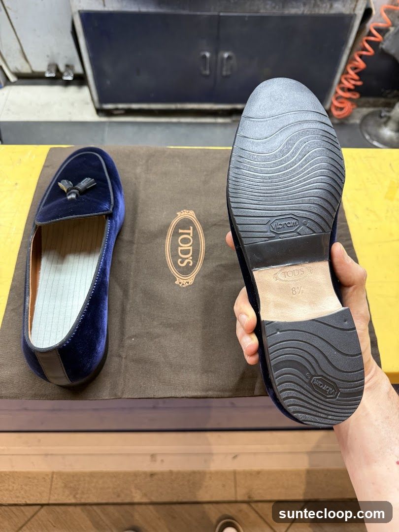 Velvet loafers on a Tod's box