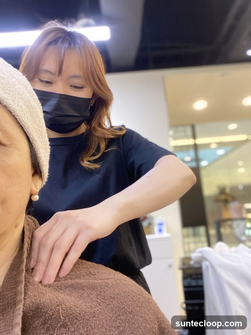 Hairdresser giving a shoulder massage