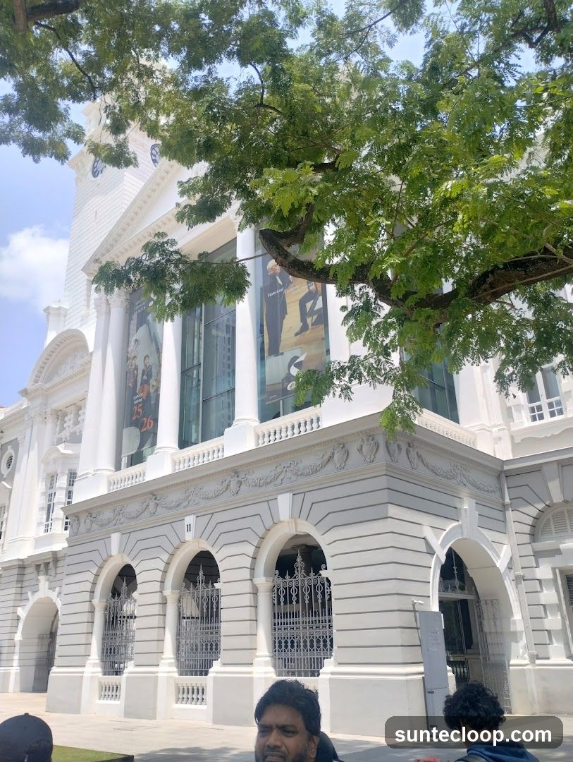 Building facade with banners and trees