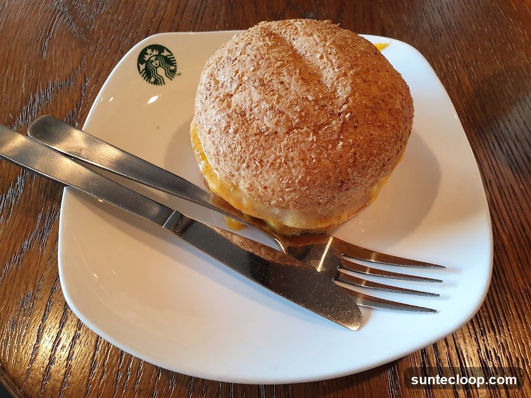 Sandwich on a plate with cutlery