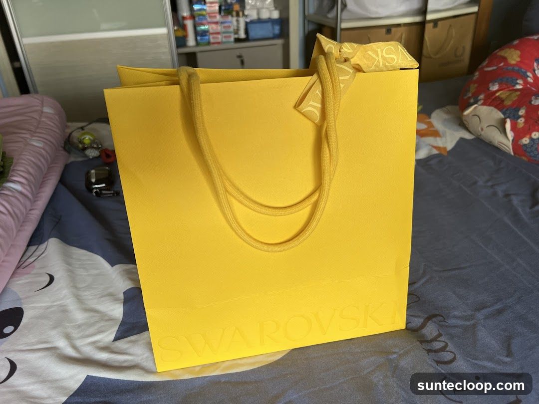 Yellow shopping bag with logo