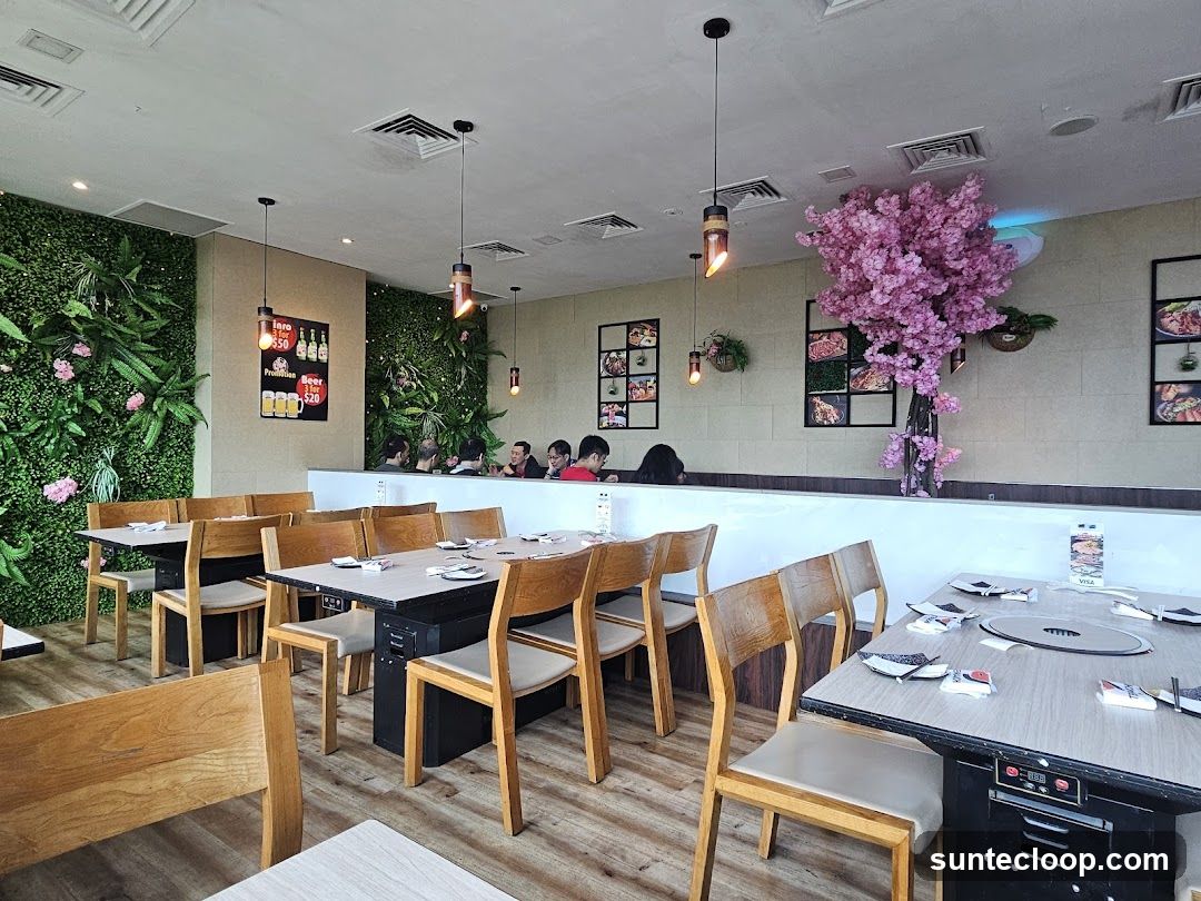 Restaurant Interior with Greenery and Cherry Blossom Tree