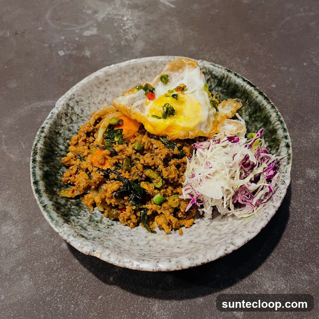 Minced Meat Dish with Fried Egg and Salad