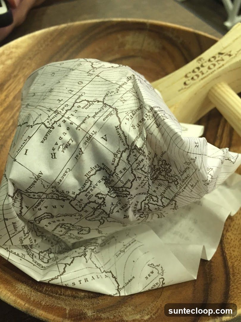 Food item wrapped in map-themed paper