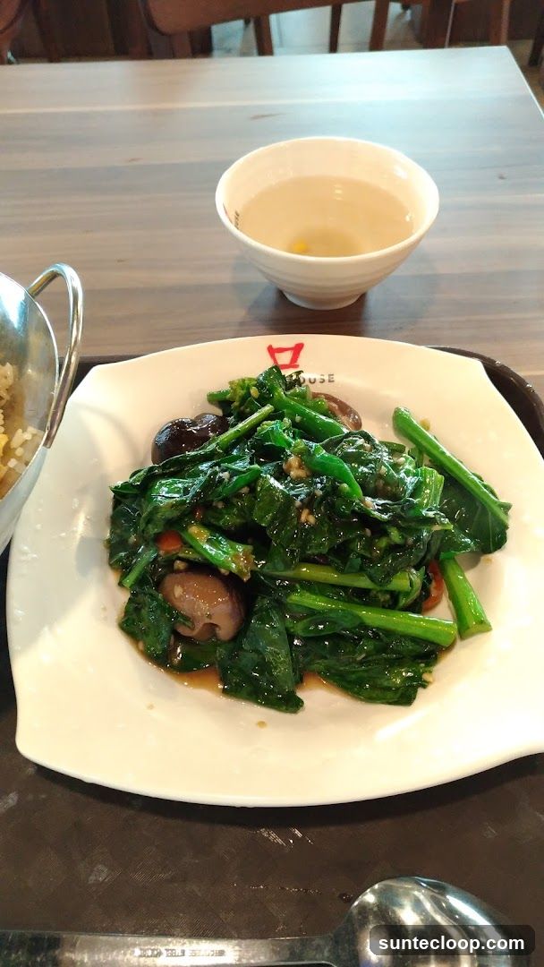 Stir-fried vegetables with mushrooms and a bowl of soup