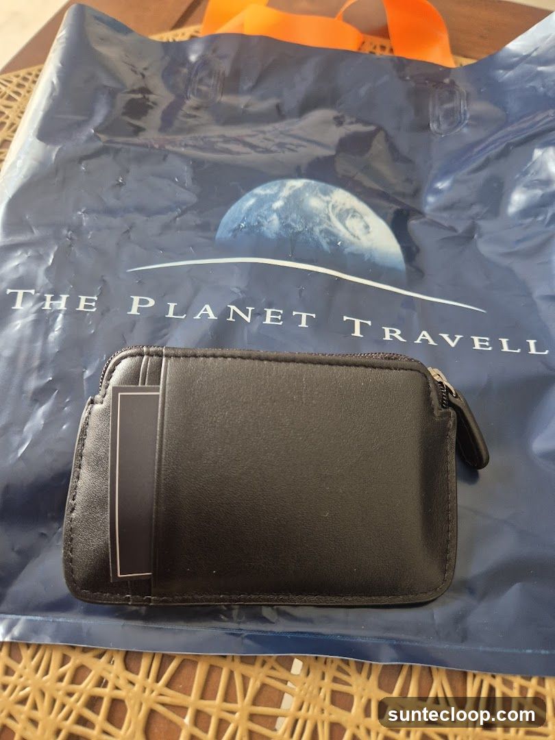 Black coin purse on a branded shopping bag