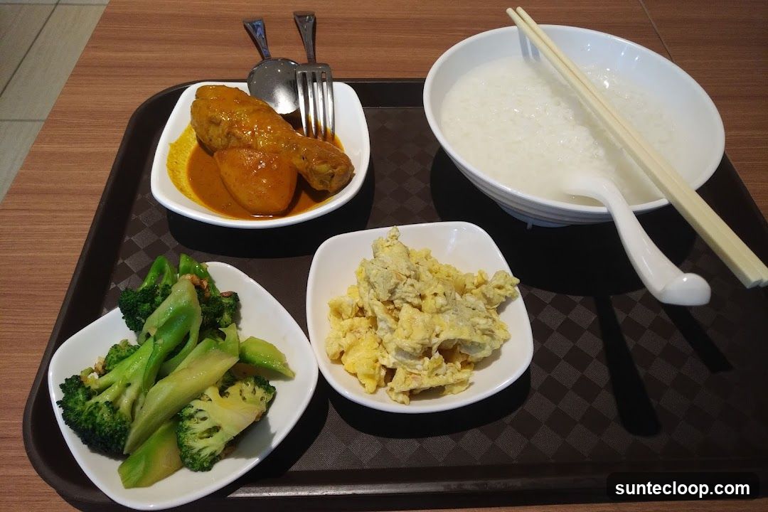 Meal Tray with Chicken Curry, Broccoli, Scrambled Eggs, and Congee
