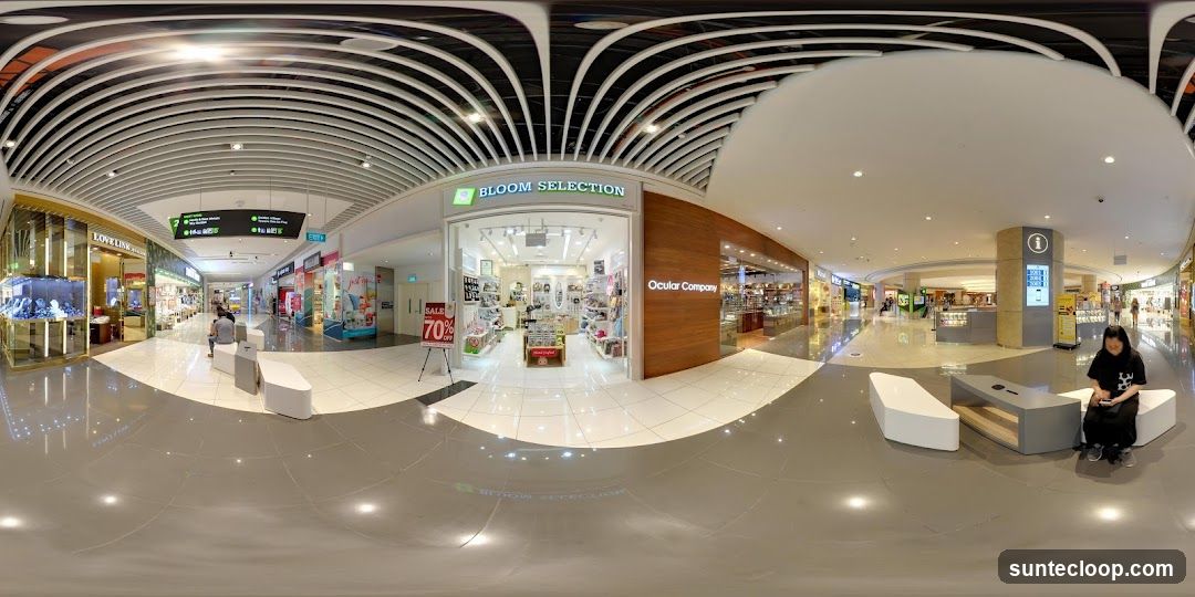 Mall Interior with Shops and Seating Area