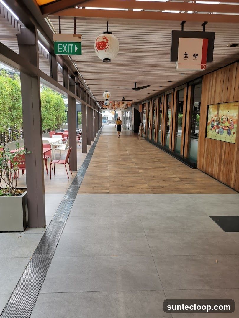 Outdoor walkway with shops and seating