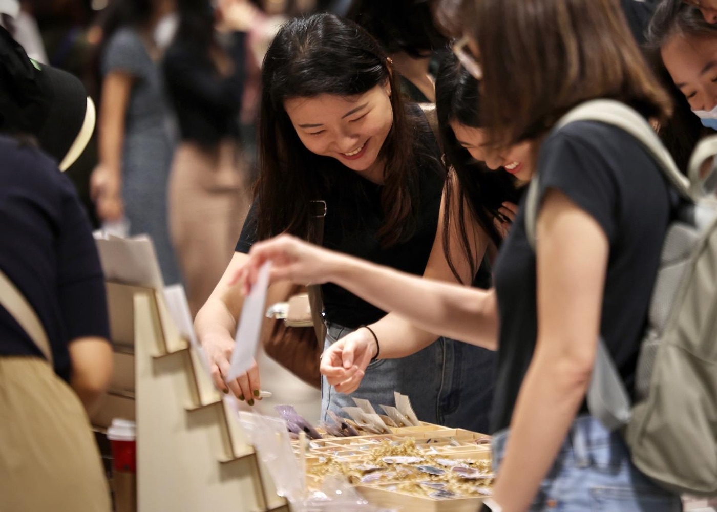 Shoppers browsing handmade jewellery at Public Garden Suntec